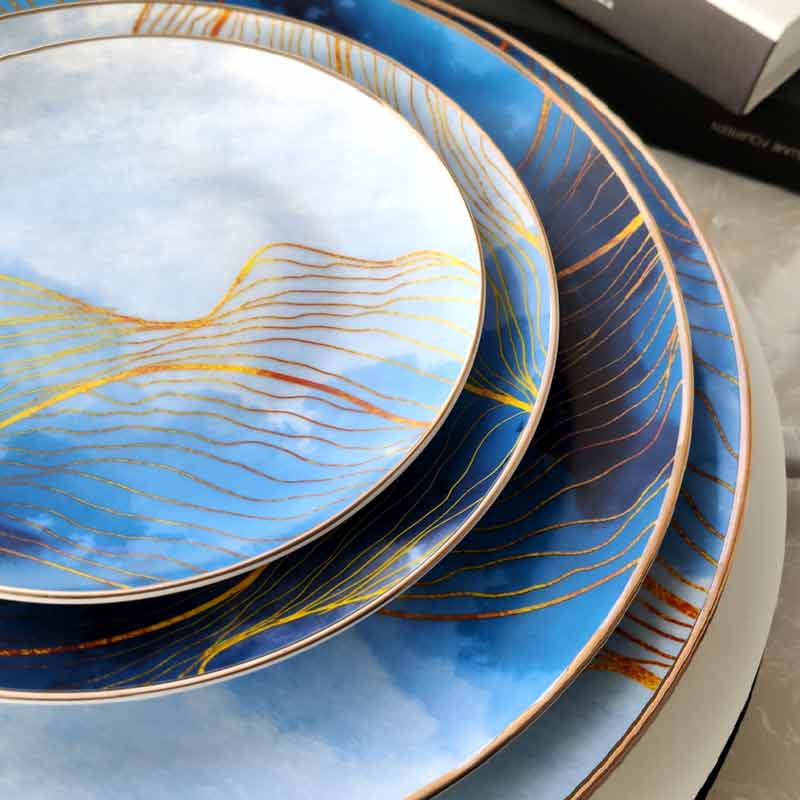 blue dining plate set with gold trim